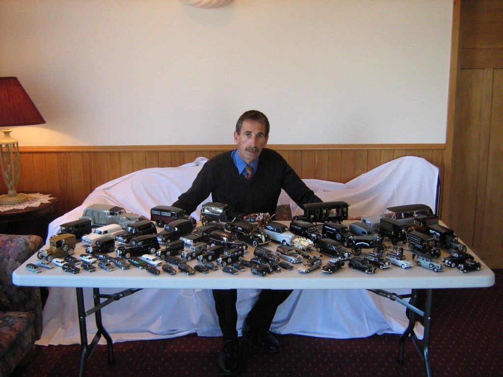 Bryce with his model hearse collection.